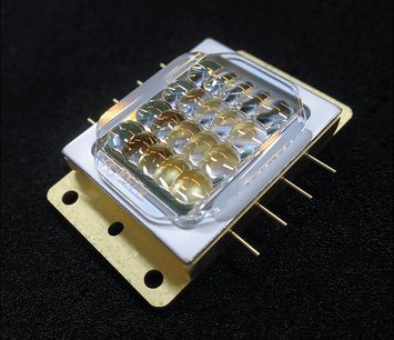 Rectangular glass lens array on a golden metallic mount, with mounting holes, for video projector