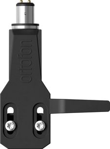 Ortofon headshell i mat sort metal, set forfra, to skrå slots til skruer, sidehåndtag, cylindrisk sølvfarvet stik