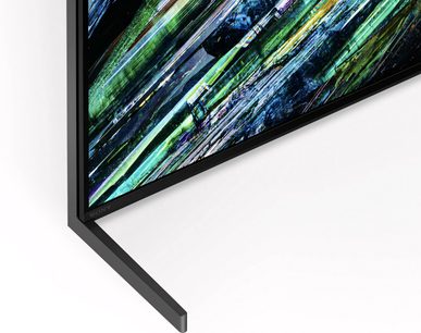 Téléviseur Sony XR65A95L, angle inférieur gauche, cadre noir fin, écran affichant des motifs abstraits colorés