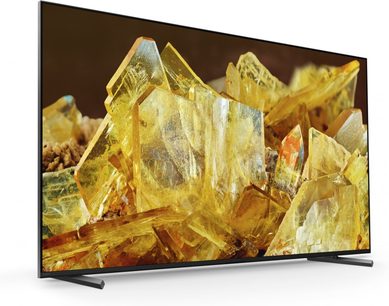 Sony XR75X90L fladskærms-tv set forfra, gule krystaller vist, tynd sort ramme, vinklede metalben