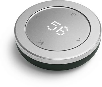 Dálkový ovladač hifi DEVIALET Remote Deep Forest kulatý stříbrný s tmavě zelenou základnou a centrálním světelným displejem