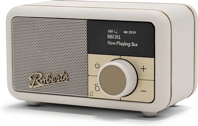 Připojený reproduktor Roberts Revival Petite 2 krémový, syntetické šasi, děrovaná mřížka, displej, otočný ovladač, pohled zepředu v úhlu 3/4