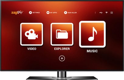 Televizní obrazovka zobrazující úvodní menu uživatelského rozhraní Zappiti s ikonami pro video, průzkumníka a hudbu