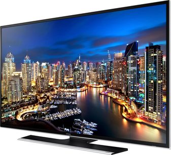 Samsung UE40HU6900 fladskærms-LED-TV, der viser et natligt vue af oplyste skyskrabere ved vandet