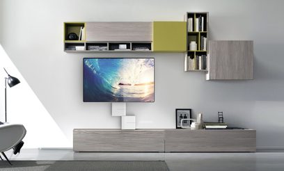 Gray wall-mounted TV stand with shelves, drawers, and space for a flat screen, in a modern living room with light gray walls