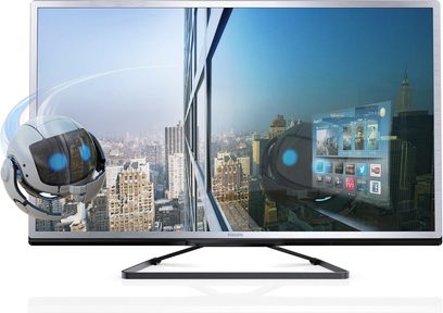 Philips 46PFL4528H fladskærms-tv, sort ramme, metalfod, viser en luftoptagelse af skyskrabere