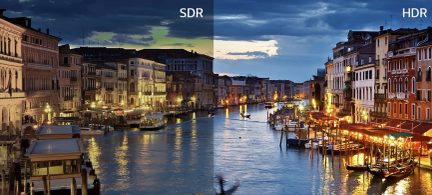 View of a canal lined with illuminated buildings, divided into two contrasting parts marked SDR on the left and HDR on the right