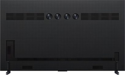 Голям висококачествен телевизор TCL 85X11K в черен матово метал и пластмаса, задна панела с решетъчен дизайн, включваща четири блестящи кръгли отвора, широки правоъгълни решетки и две тъмни странични крака, задна гледна точка