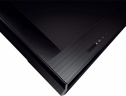 Sony KDL-32CX520 sort TV, set fra siden, slukket skærm, smal ramme, rektangulær fod, sideknapper til betjening