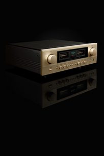 Integreret stereo hi-fi forstærker E-280, set fra trekvart vinkel, forgyldt front, runde knapper, to skærme, sort overflade