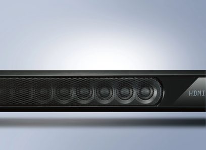 Yamaha YSP-3300 sort soundbar, set forfra, sort gitter, LED-skærm, på reflekterende grå overflade