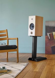 Focal Chora 806 speaker stand in light wood and black metal, front view, with white speaker placed on top