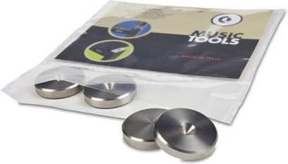 Gennemsigtig plastemballage med 4 MusicTools "Floor Saver" 20mm metalspidser, placeret på sort skum