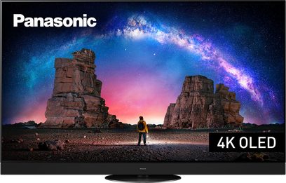 Panasonic TX-65LZ2000E 4K OLED-TV, der viser et klippelandskab under en stjernebestrøet himmel med en person set bagfra i midten
