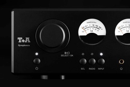 Černý zesilovač T+A Symphonia, přední panel s velkým ovládacím knoflíkem, dvěma kulatými VU metry a sluchátkovým konektorem