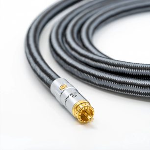 Slightly top-down view of the Oehlbach Sub Xtreme black subwoofer cable with braided nylon sleeve, straight silver RCA connector with gold-plated contacts
