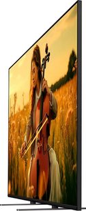 Sony BRAVIA 5 K85XR5 højopløsnings-tv i sort, ultratynd metalramme og glasfront, billede af en kvinde der spiller cello, set skråt forfra fra venstre side