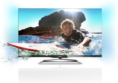 Philips 42PFL6907H-fladskærm viser en ung, blond dreng, der surfer på en bølge, nærbillede med vandsprøjt