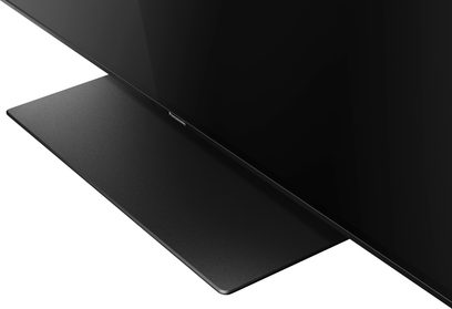 Panasonic TX-55FZ800E teler, must lapik ristkülikukujuline ekraan, külgvaates, õhukese raamiga, asetatud tasasele pinnale