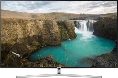 Samsung UE75KS8000 TV viser et tyrkisblåt vandfald mellem klippeformationer, set forfra