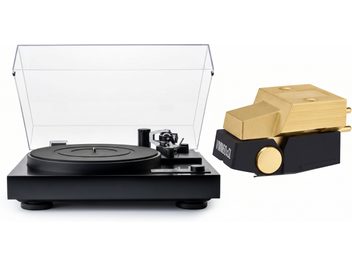 Black turntable with an open transparent dust cover, accompanied by a black and gold phono cartridge