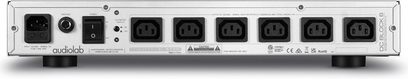 Conditionneur secteur Audiolab DC-BLOCK 6 ασημί με 6 ευθυγραμμισμένες πρίζες, διακόπτη, σύνδεσμο τροφοδοσίας και μαύρα πόδια
