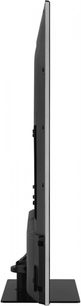 Panasonic TX-55GX600E-fladskærms-tv, set fra siden, flad skærm, smal sort ramme, centreret rektangulært sort fod