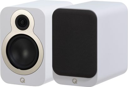 Two matte white Q Acoustics 3020c bookshelf speakers in a rectangular enclosure with rounded corners, shown in a three-quarter front view—one revealing its black tweeter and woofer with champagne-colored surrounds, while the other features a removable black acoustic grille.