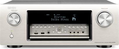Wzmacniacz kina domowego Denon AVR-X4100W w kolorze srebrnym, widok z przodu, wyświetlacz "Blu-ray Dolby Atmos", przyciski i gniazda z przodu
