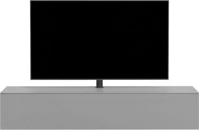 Mobile audio-video Spectral Core 30 grigio, con frontale liscio senza maniglie e televisore su supporto centrale, visto di fronte