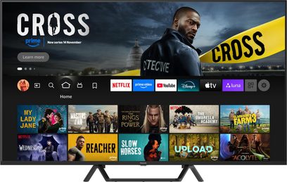 Televisor de alta definición Panasonic TV-55W95BEG negro con marco delgado de plástico y dos patas en V negras mate, gran pantalla plana vista de frente mostrando la interfaz de inicio de streaming.