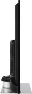 Panasonic TX-50LX660E-fladskærms-tv, set fra siden, flad skærm, sort ramme og fod, stik på bagsiden