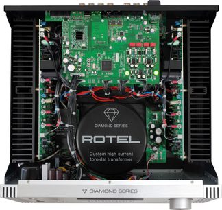 Rotel RA-6000 sort hi-fi stereoforstærker, indvendig visning af grønt printkredsløb med elektroniske komponenter, toroidaltransformer