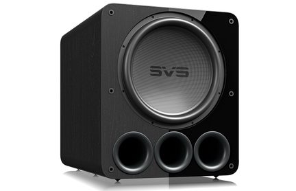 Sort subwoofer i sort, set forfra, med 3 cirkulære åbninger nederst, central højttaler, afrundede hjørner, tekstureret overflade