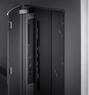 Телевізор Loewe Vega 32 чорного кольору, вигляд ззаду з відкритою кришкою та роз’ємами HDMI, USB-C і гніздом для навушників