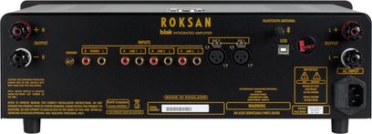 Frontvisning af en Roksan blak integreret stereoforstærker i antracitgrå finish med sort front og forgyldte knapper