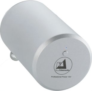 Ekstern strømforsyning til pladespiller, sølv cylinder, vinkelvisning, front med logo, centralknap, blåt indikatorlys