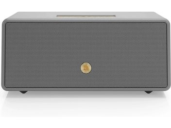 Enceinte connectée Audio Pro Drumfire D-2 W grise, vue de face, avec grille perforée et logo doré au centre