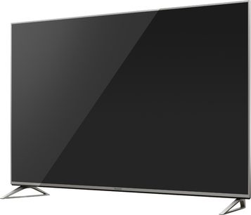 Televisor Panasonic TX-50DX730E visto de frente, tela preta brilhante, moldura fina prateada, suportes metálicos