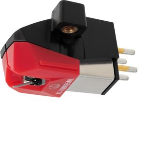 Audio Technica AT-VM95ML phono cartridge cell in red and black plastic with a gray metal body, three-quarter front view, visible stylus tip, and four gold-plated connection pins