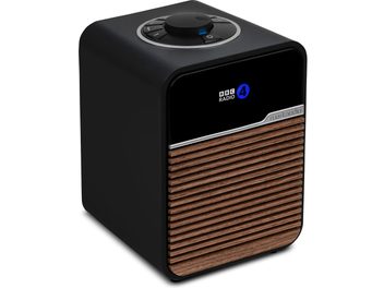 Ruark Audio R1S table radio, black, wood slat front, display, top control knob, 3/4 front view