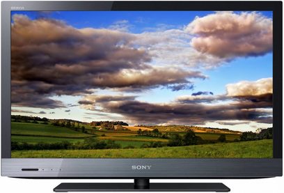 Sony KDL-40EX521 TV-skærm, der viser et landligt landskab med marker, træer og en skyet himmel ved solnedgang