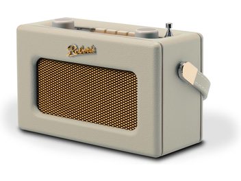 Radio Roberts Revival Uno BT v krémové barvě, obdélníkový pouzdro z krémové umělé kůže s pozlaceným kovovým mřížkováním na přední straně, zlaté logo Roberts, pohled z pravého předního tříčtvrtečního úhlu ukazující krémové horní tlačítka, chromovanou vysouvací anténu a barevně sladěný boční popruh