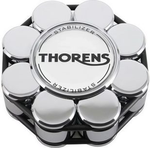 Chrome stabilizer clamp for Thorens turntables, top view, central circular surface with black text, edges composed of several shiny cylindrical elements connected by a black structure