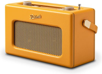 Radio Roberts Revival iStream 3L gialla in pelle grainata, vista da tre quarti anteriore, griglia dell'altoparlante metallica dorata, due pulsanti superiori beige, antenna telescopica e maniglia laterale con ferratura dorata.