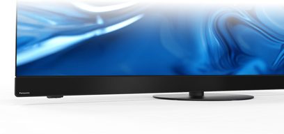 Nærbillede forfra af Panasonic TV-65Z90B sort højopløsnings-tv, slank metalramme med integreret perforeret højttalerbar og centralt rundt fodstativ