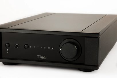 Rega Brio MK7 stereo integrated hi-fi amplifier with black casing, rotary knob on the right, 2 buttons and jacks on the left, central display