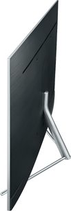 Samsung QE65Q7F 2017 TV set fra siden, sort skærm, sølvfarvet metalramme og -fod, slank og kurvet design