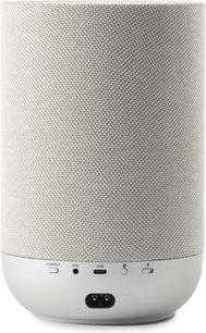 Trådløs Denon Home 200-højttaler i stengråt meshstof, set bagfra med AUX- og USB-porte samt betjeningsknapper