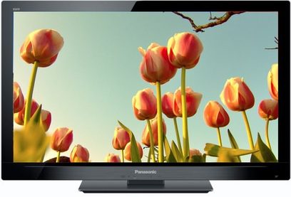 Nærbillede af lyserøde og gule tulipaner på skærmen af en Panasonic TX-LF32E30 fladskærms-tv, set nedefra